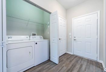 A laundry room with a washer and dryer.